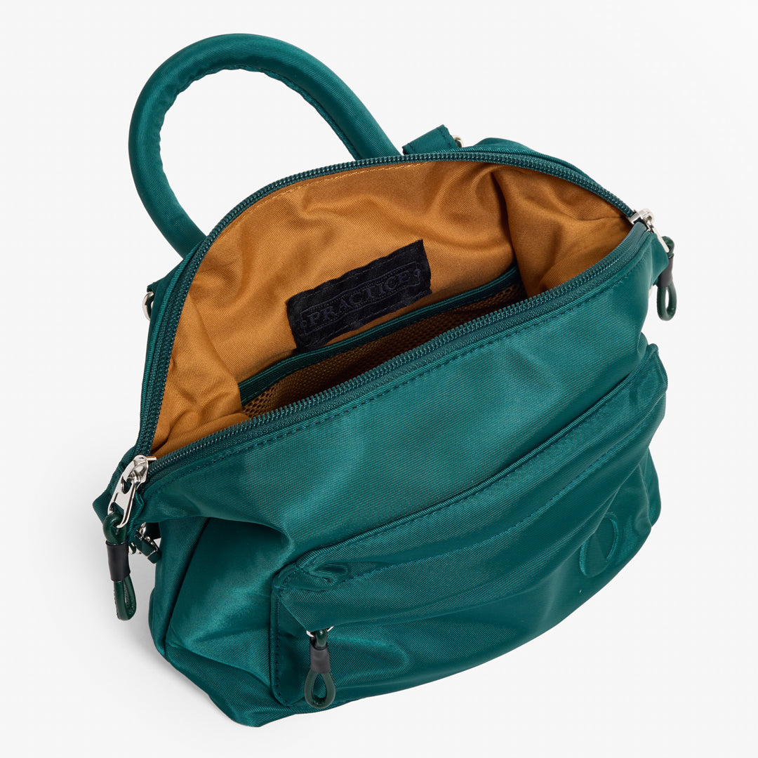 Practice Karma Mini Crossbody bag in Forest green color interior of bag tan lining material