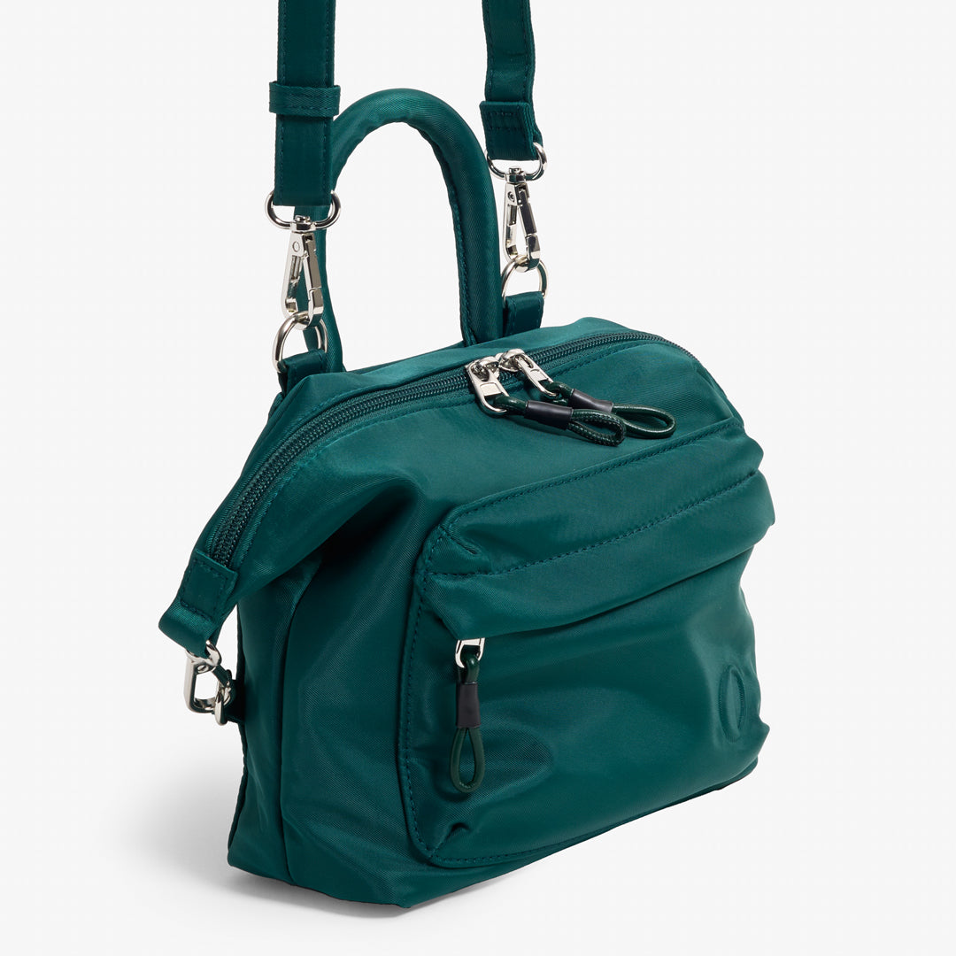 Practice Karma Mini Crossbody bag in Forest green color side angle of front of bag