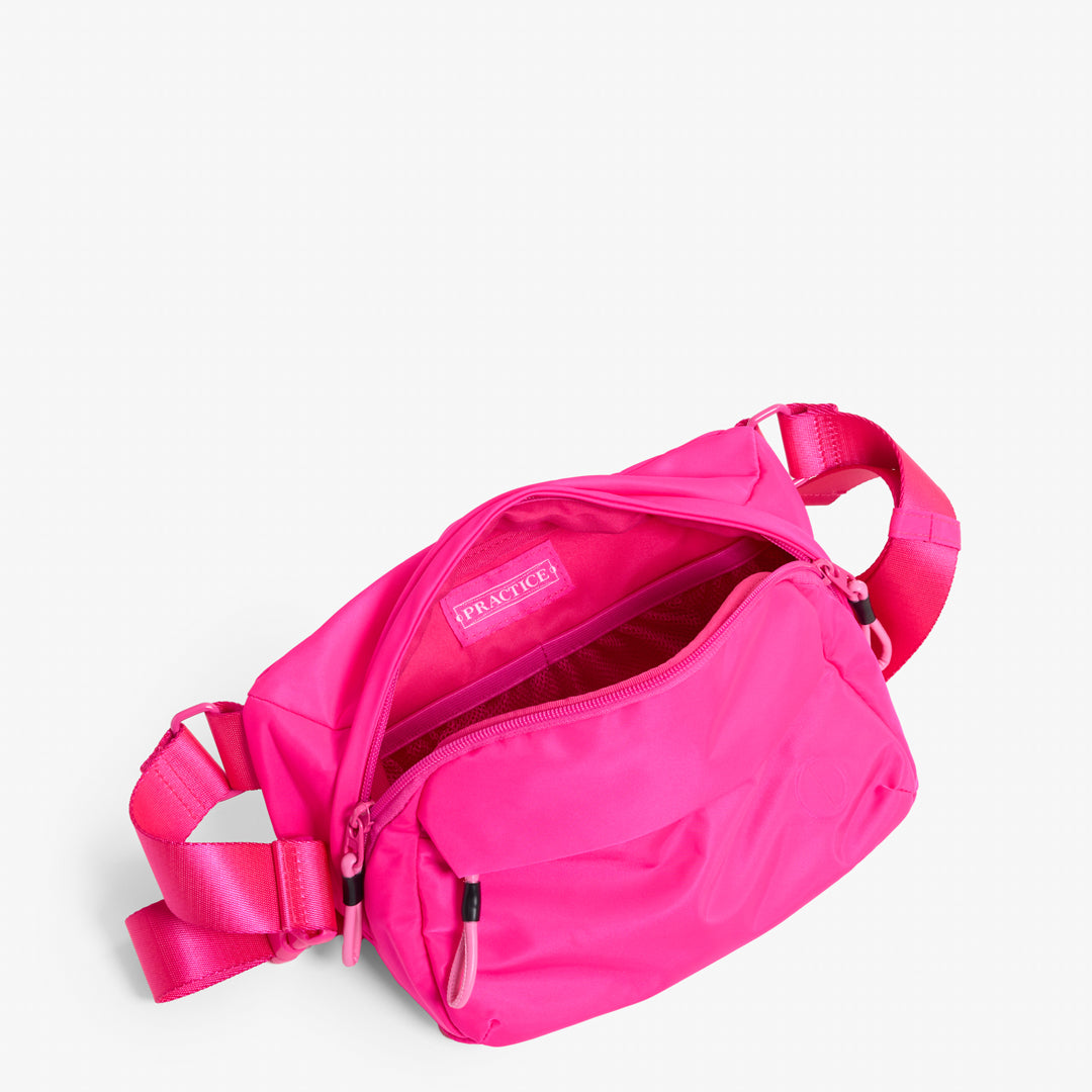 Practice Phase Sling Pack belt bag in Dragonfruit hot pink color interior bag