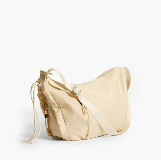 Practice Demilune Shoulder Sling bag in Tofu cream color