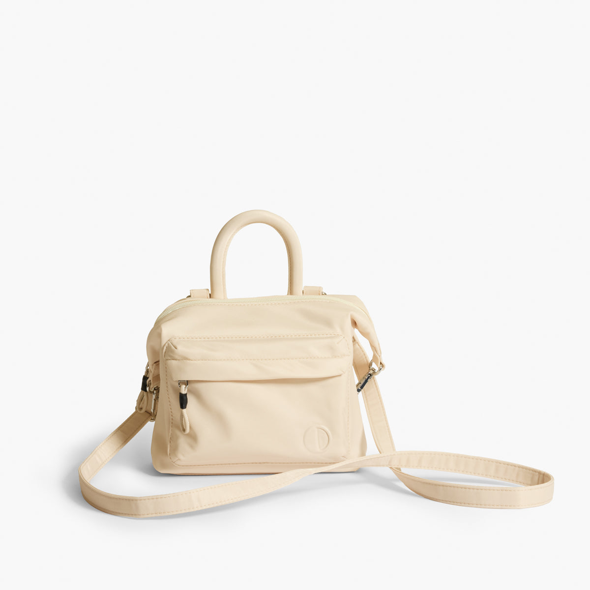 Practice Karma Mini Crossbody bag in Tofu cream color with crossbody strap extended