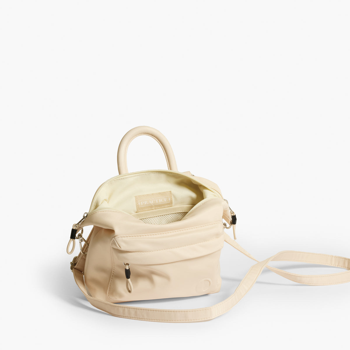 Practice Karma Mini Crossbody bag in Tofu cream color interior view with crossbody strap