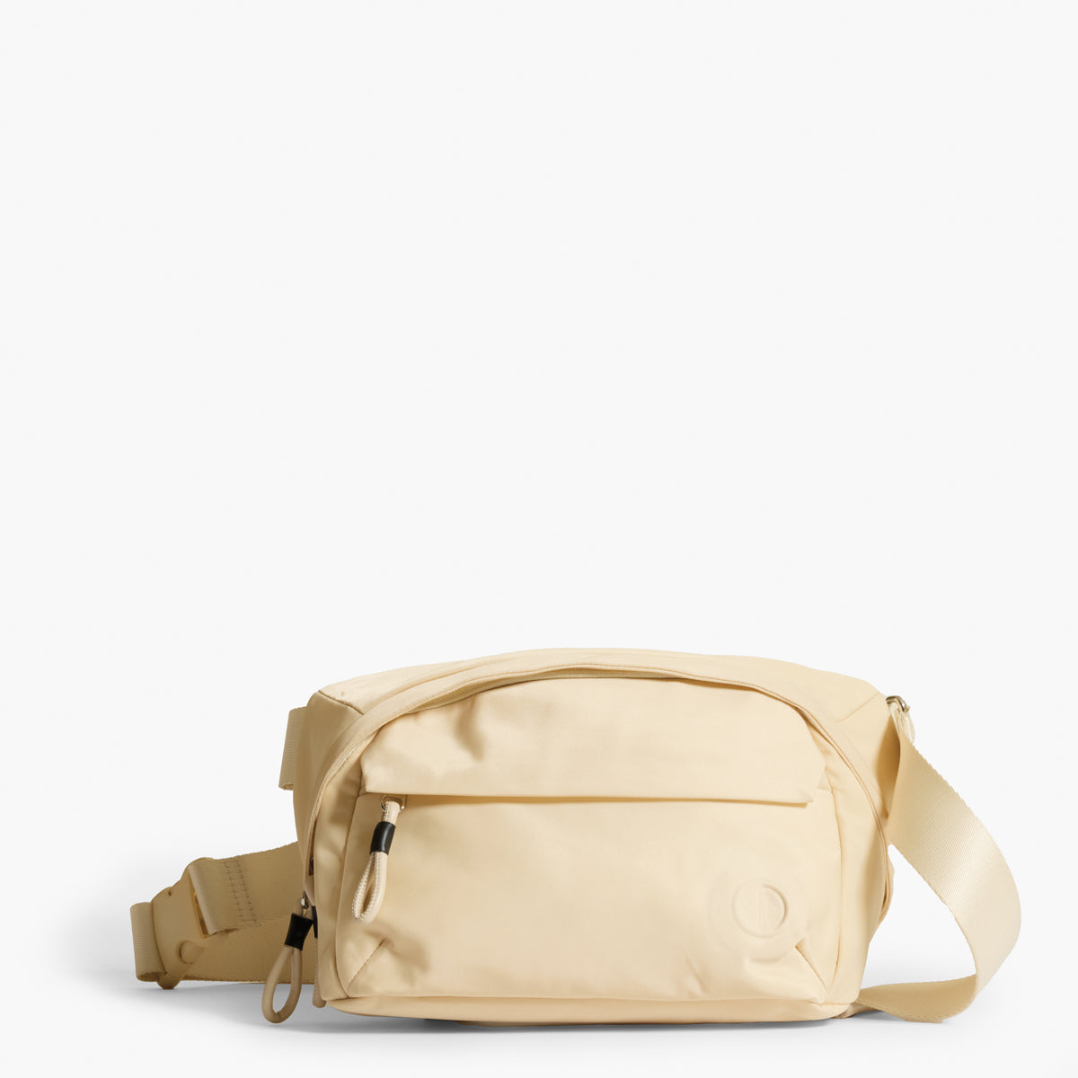 Phase Sling Pack belt bag in Tofu cream color close up front of bag