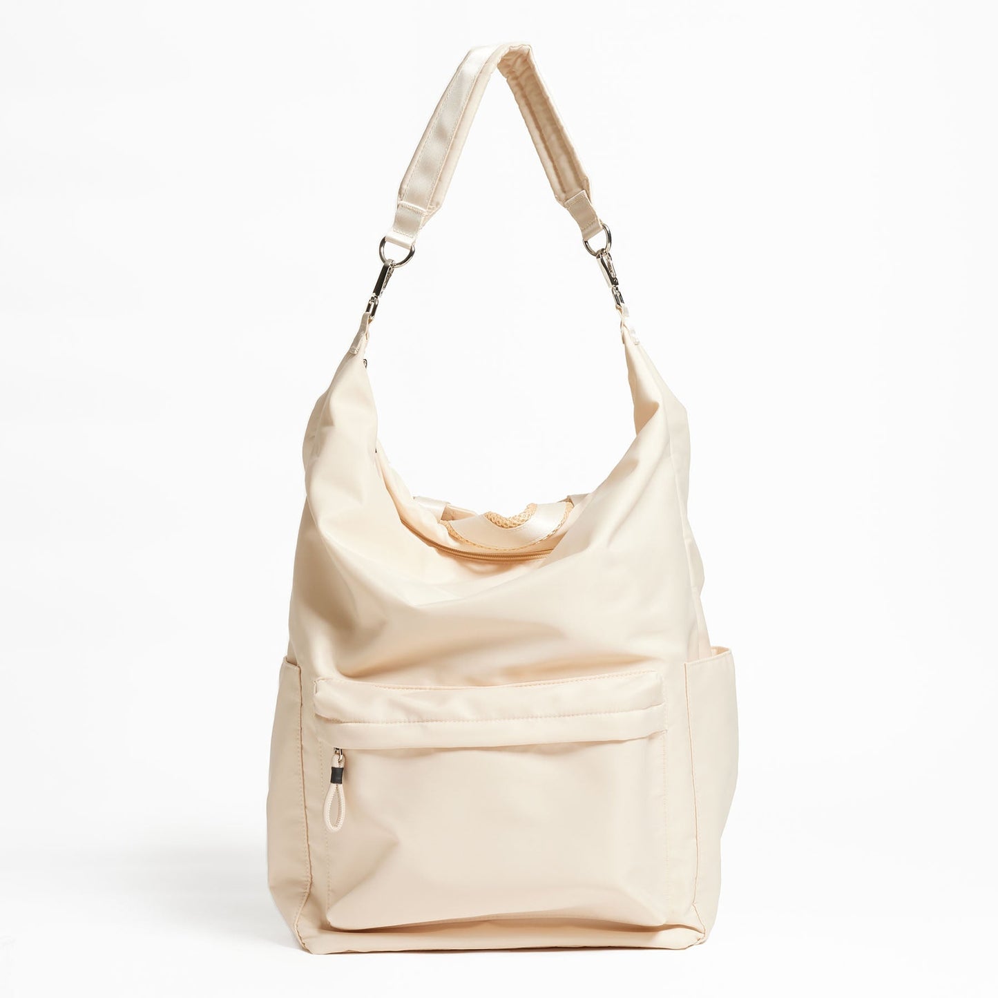 Karma Convertible Backpack in Tofu displayed as a shoulder bag