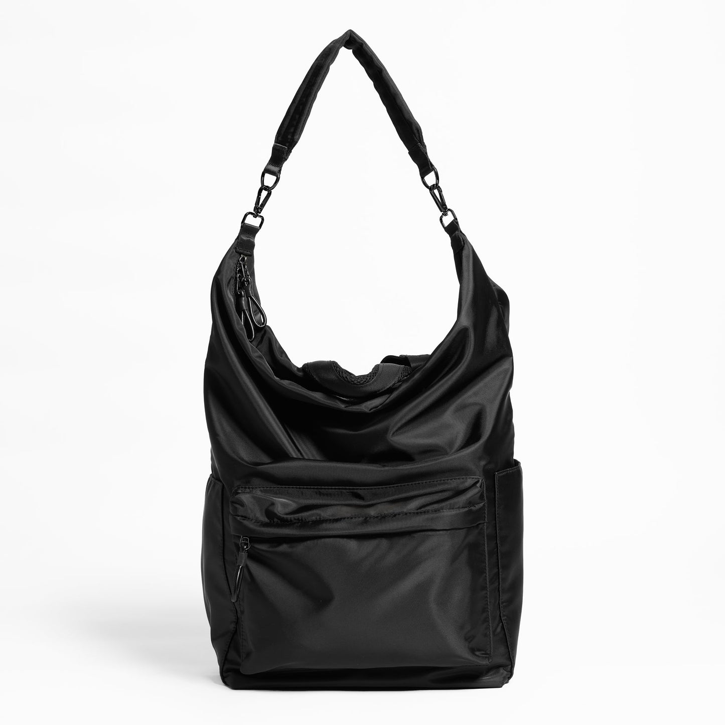 Front Facing view of the Karma Backpack in Black Nylon. Backpack has a top handle and a convertible strap to carry your backpack as a tote for easy grab and go!