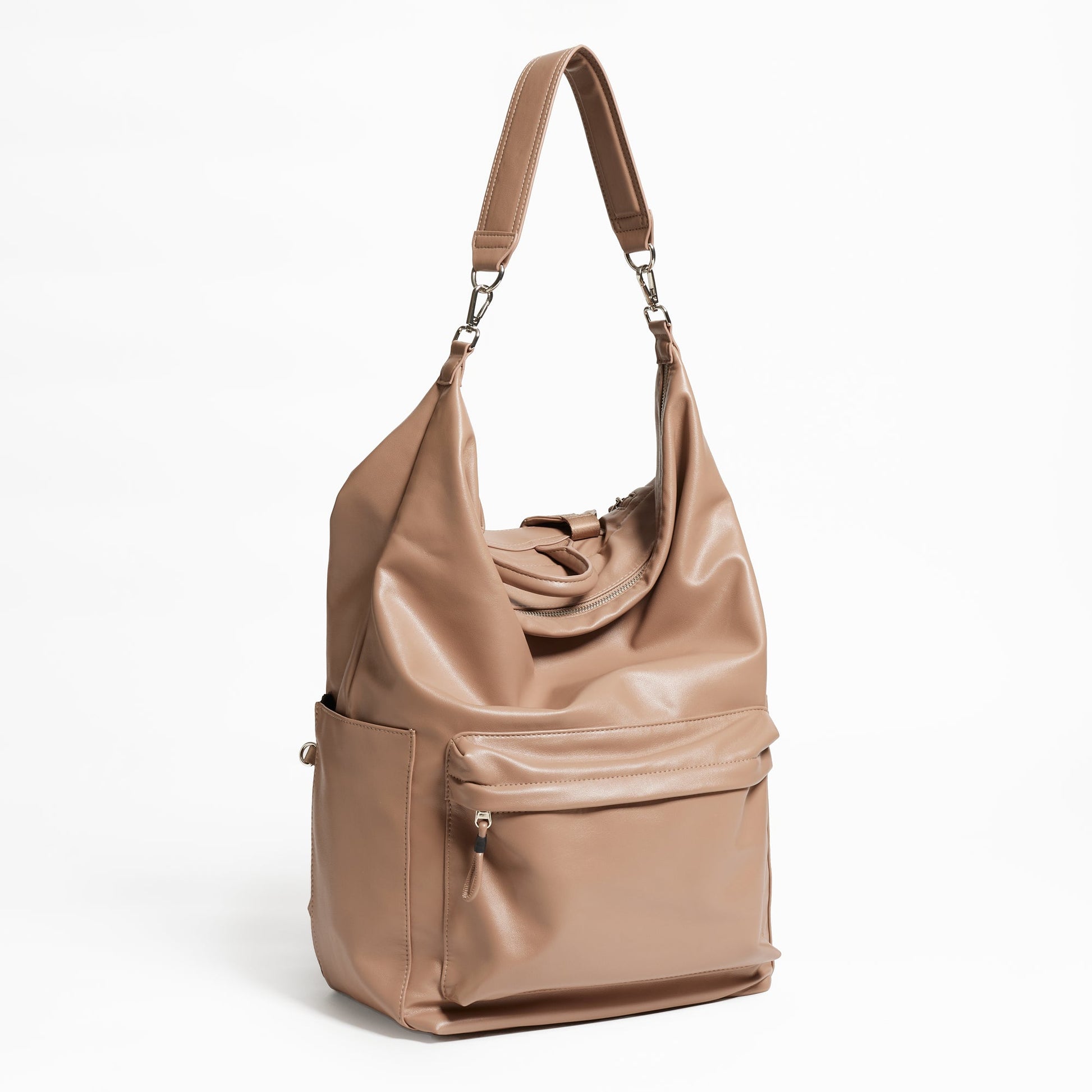 Front Facing view of the Karma Backpack in Mushroom colored Vegan Leather. Backpack has a top handle and a convertible strap to carry your backpack as a tote for easy grab and go!
