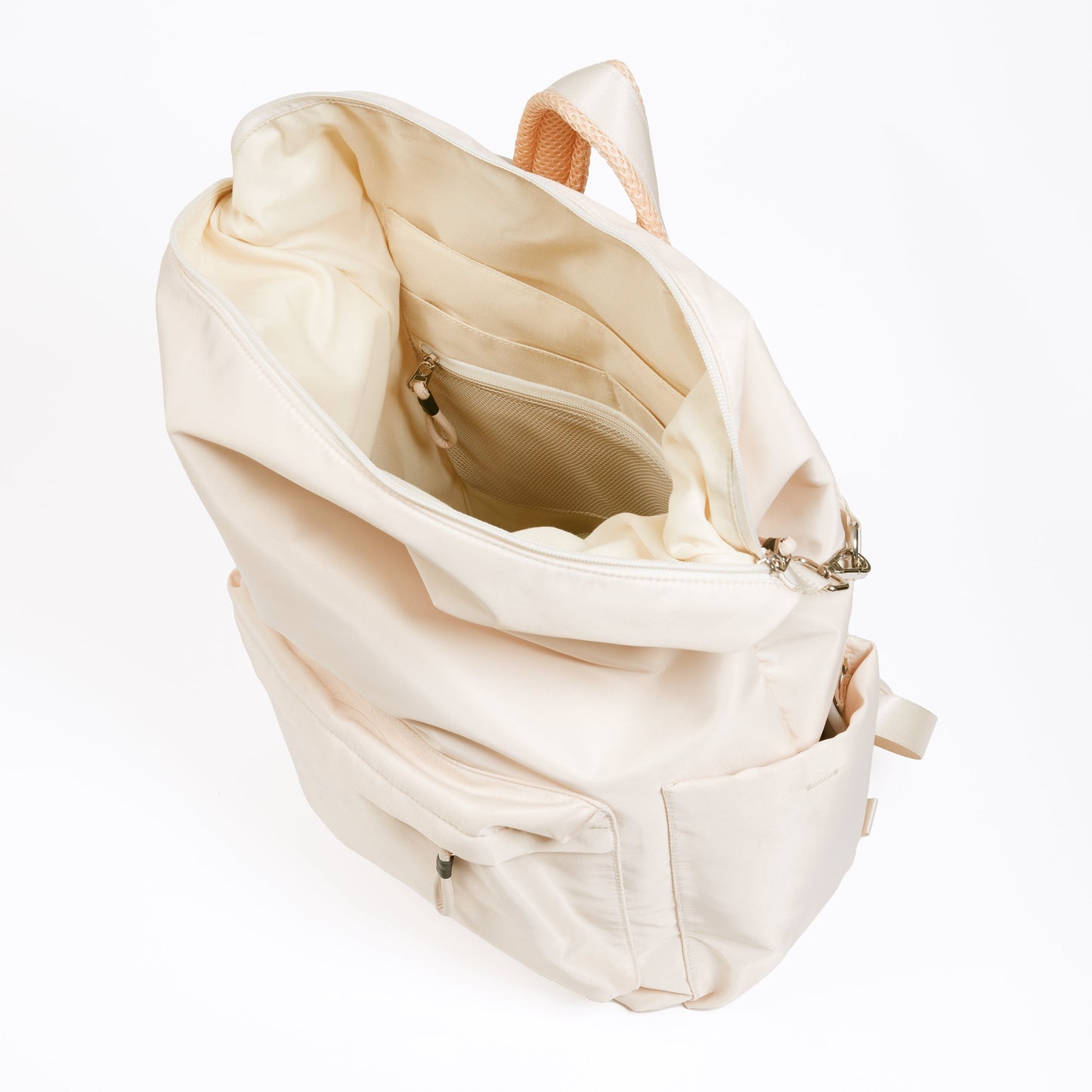 Karma Tofu Backpack with top zipper open showing ivory interior and multiple interior pockets