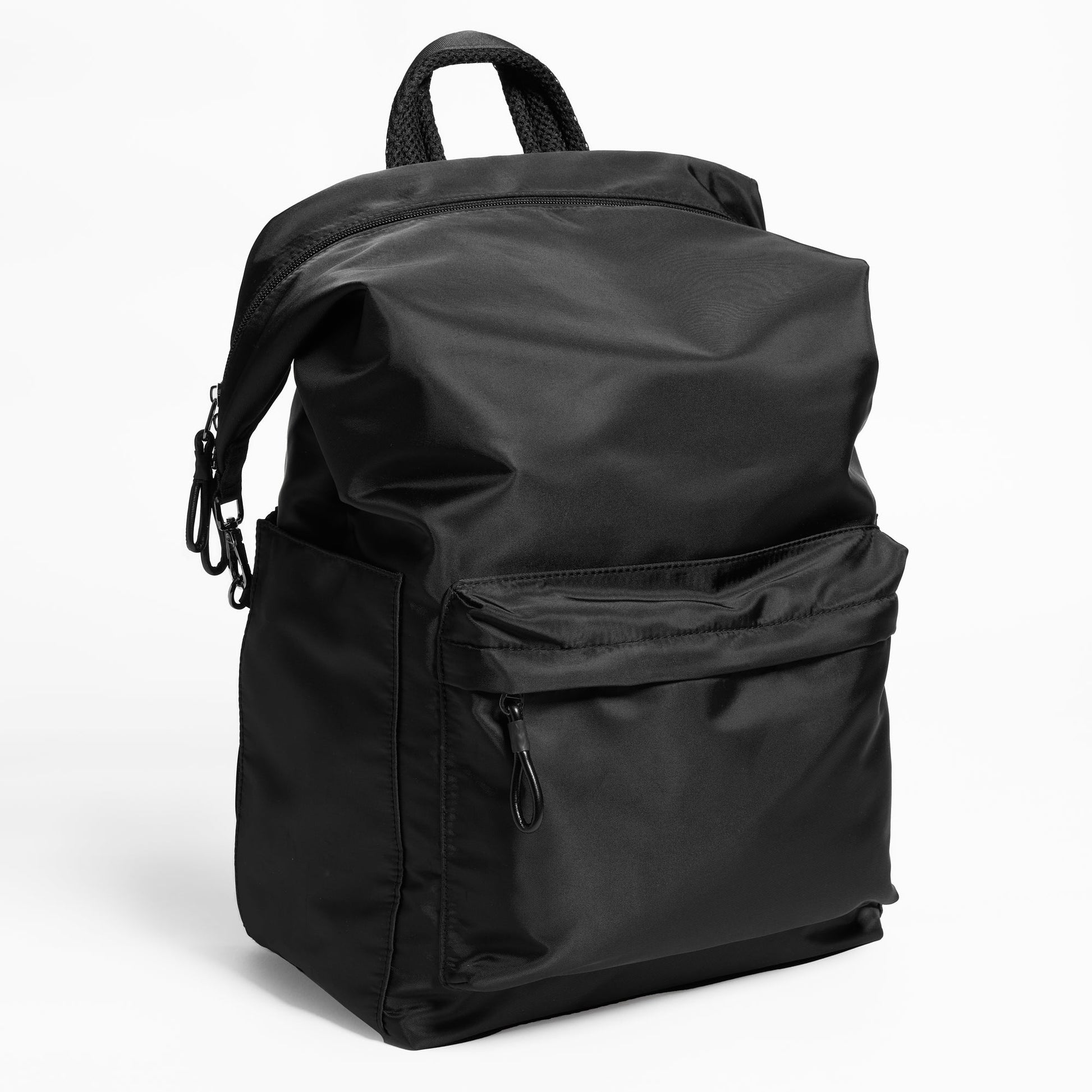 Angled Front Facing view of the Karma Backpack in Black Nylon. Backpack has a top handle and a convertible strap to carry your backpack as a tote for easy grab and go!